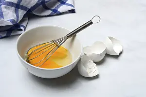 Kitchen Food Photography Stampe: Whipped egg in shell with whisk, egg shells