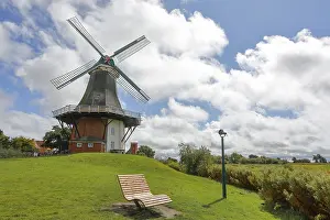 Lower Saxony Tourism Stampe: A windmill in front of a dramatic blue sky