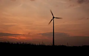 Deserted Wind Farm Stampe: Windmill against evening sky