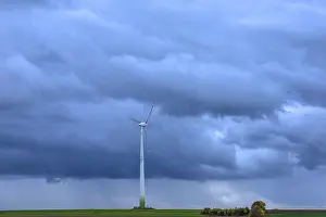 Wind Powered Electricity Generation Stampe: Windmill with rain clouds, Kasberg