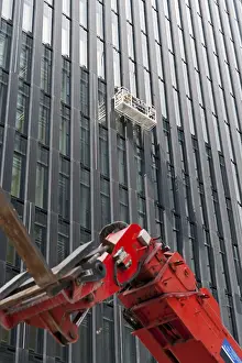 Construction Equipment Use Stampe: Window cleaner on the facade of a skyscraper