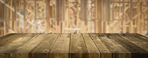 Empty Construction Site Stampe: Empty wood table surface display background with construction theme behind