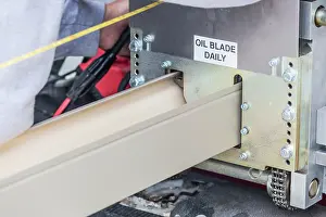 Rain Gutter Installation Stampe: Worker Measuring Rain Gutter Processing Through Seamless Shaping Machine