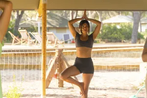 Yoga Instructor Stampe: Yoga instructor practicing the tree pose