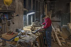 Northern German Youth Stampe: Young man at a Flex in his workshop