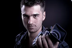 Portrait Photography Techniques Stampe: Young man with a medium format camera, portrait